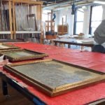 Paintings on a worktable.