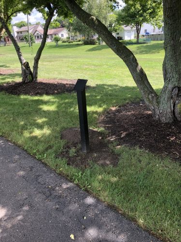 close up of a story walk post